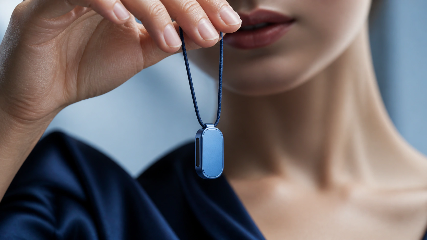 Azure Presence Key pendant held in one hand