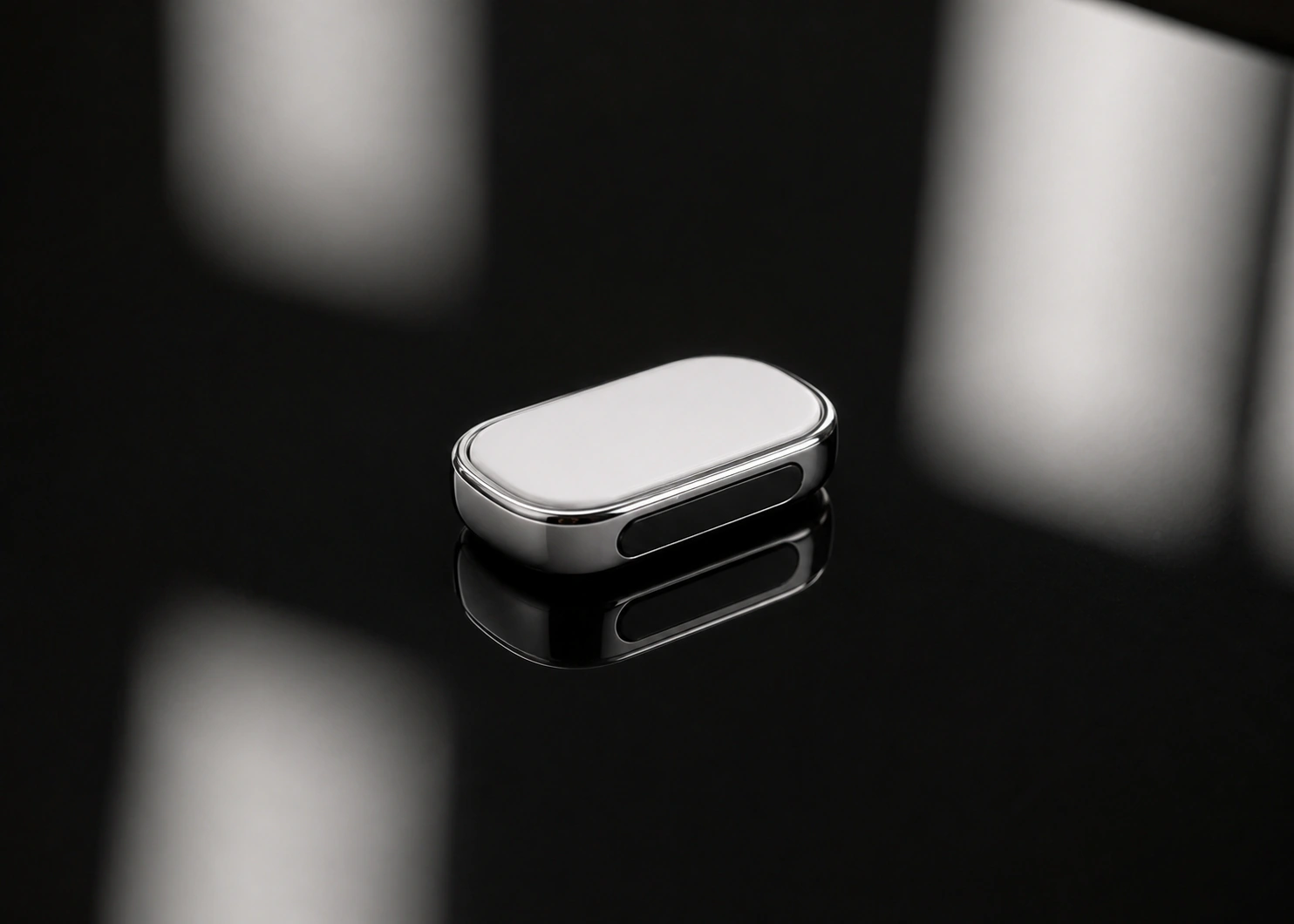 Presence Key in mirror chrome on black glass