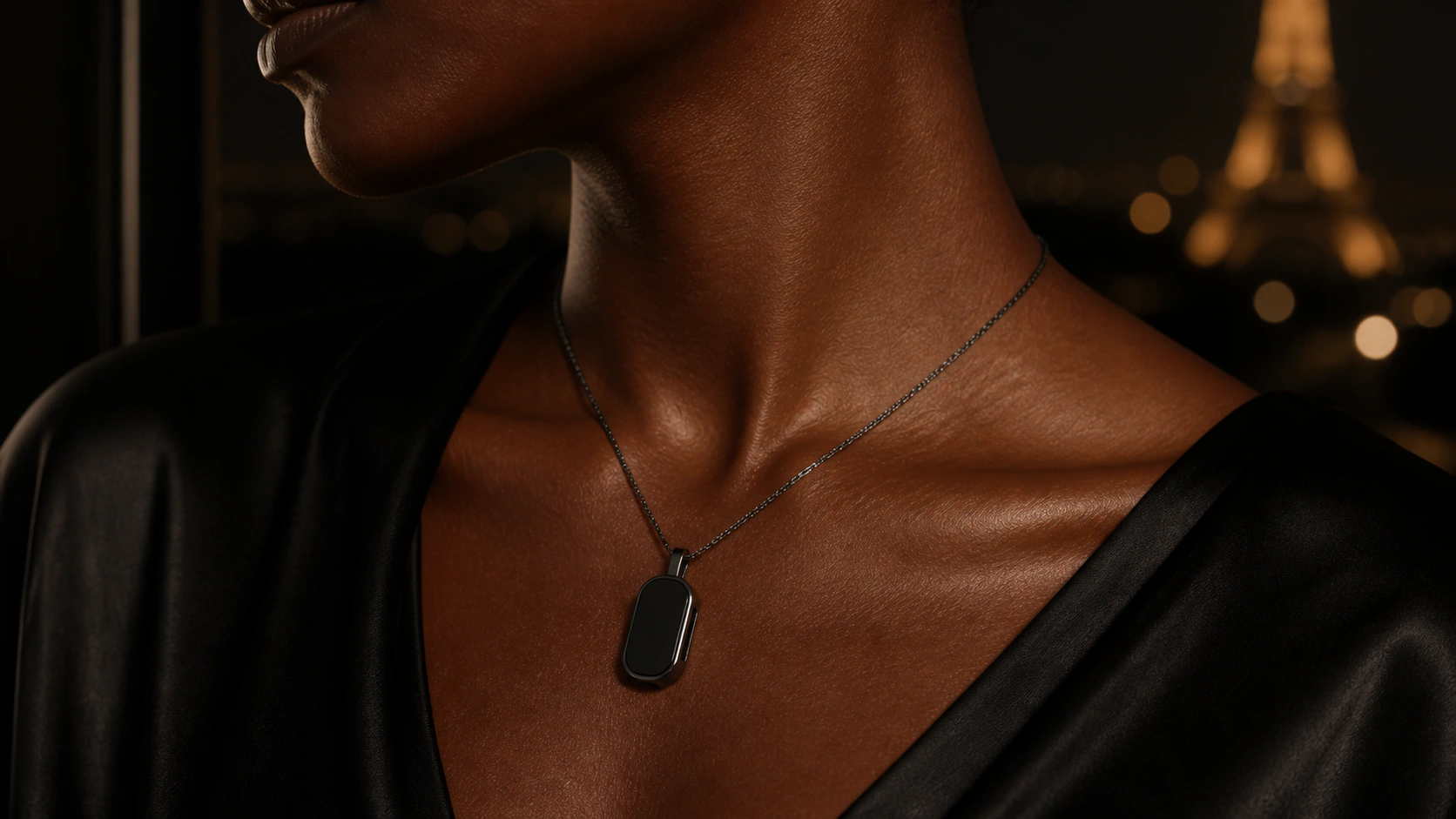 Graphite Presence Key worn as an evening pendant
